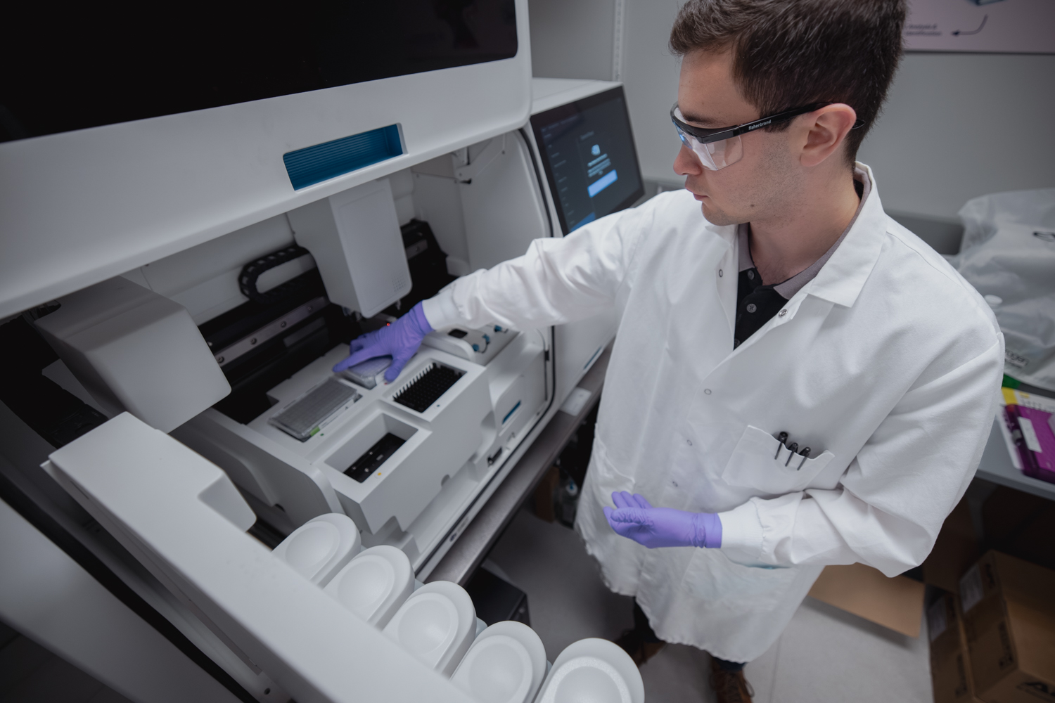 Shon Alimukhamedov, Research Associate at the Brain Resilience Laboratory, using high end machinery in the Brain Resilience Lab. Image credit: Andrew Broadhead