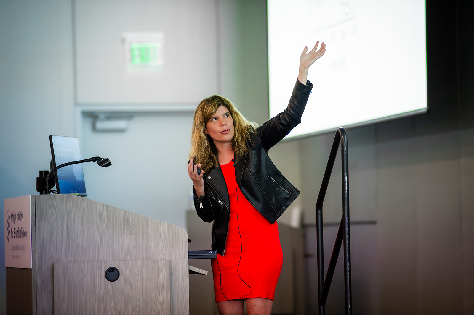 Anne Brunet gestures toward a screen.