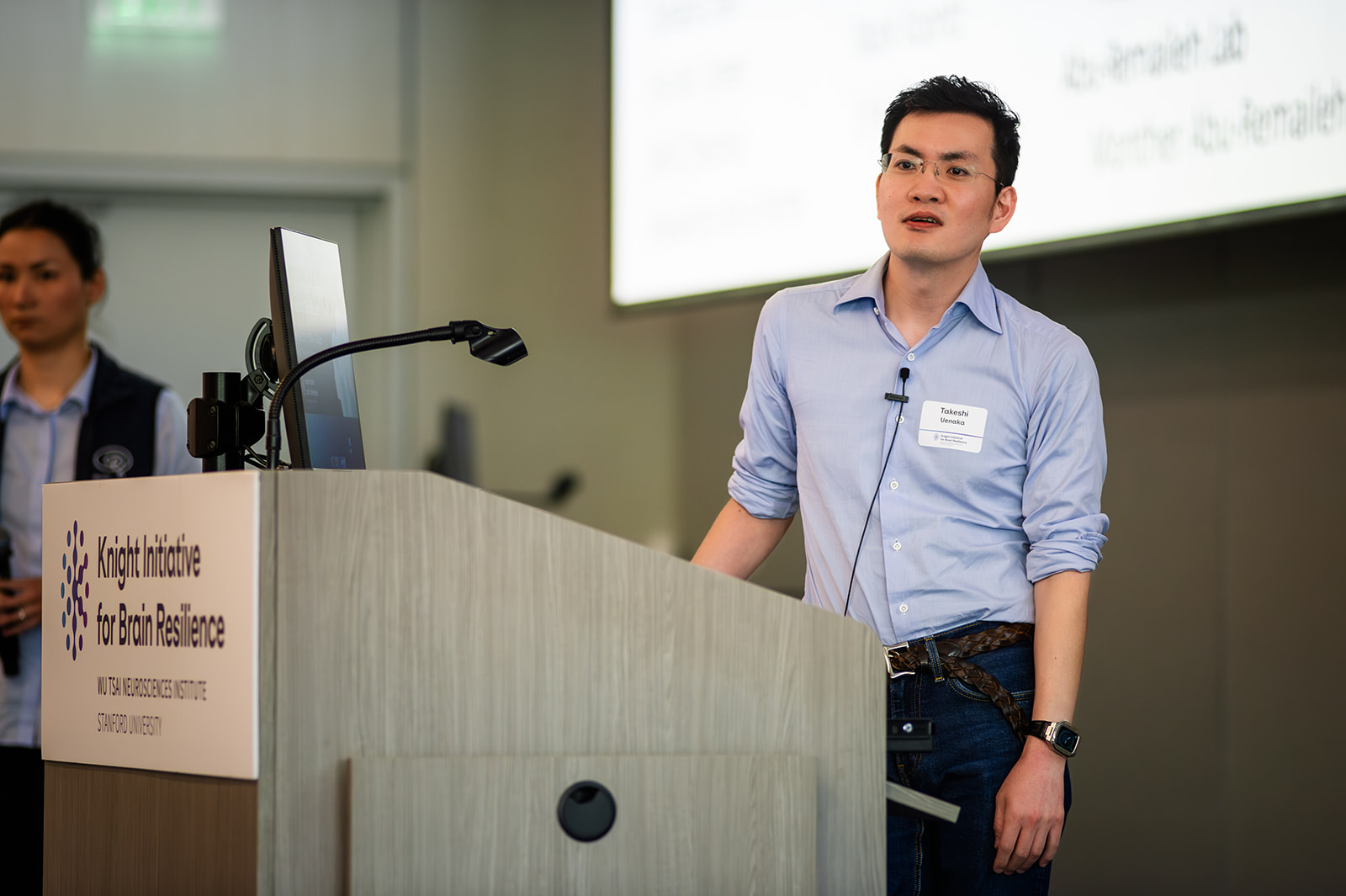Takeshi Uenaka listens to an audience question.