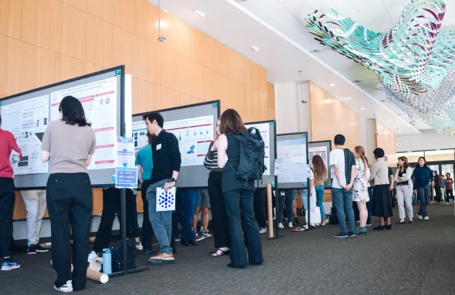 Stanford neuroscience researchers gather at the Knight Initiative's Year-End Symposium and Research Showcase at the poster session contest.  