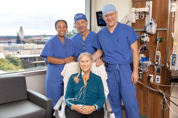 Debbie Styles smiles with her surgical team. Standing, from left to right: Tiffany, a research coordinator for the CARDIAC-PND Study, Dr. Martin Angst, and Dr. Igor Feinstein. 