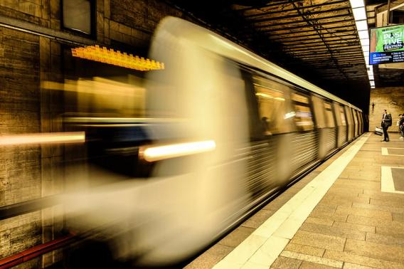 A subway train in motion.