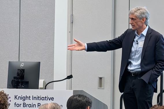 Frank Longo speaks in front of an audience